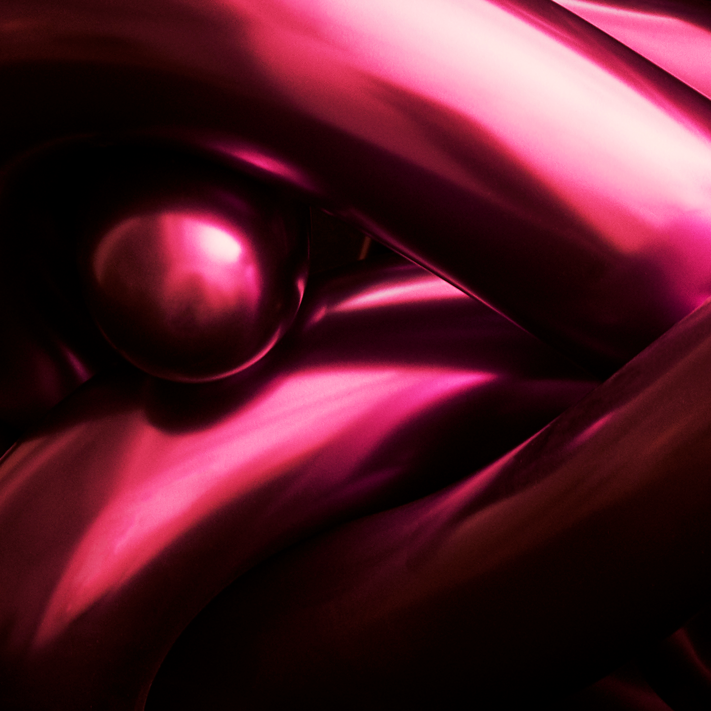 Close-up of a pink metallic surface with a reflective quality