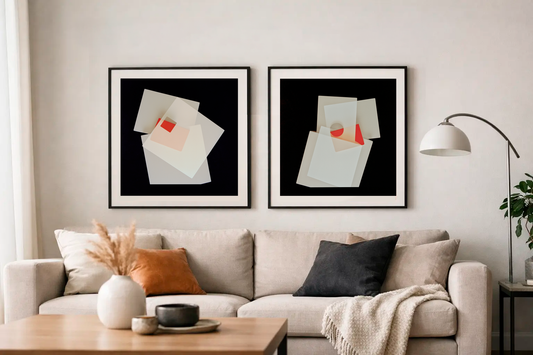 Two framed photogrphic prints in a contemporary lounge room over a sofa