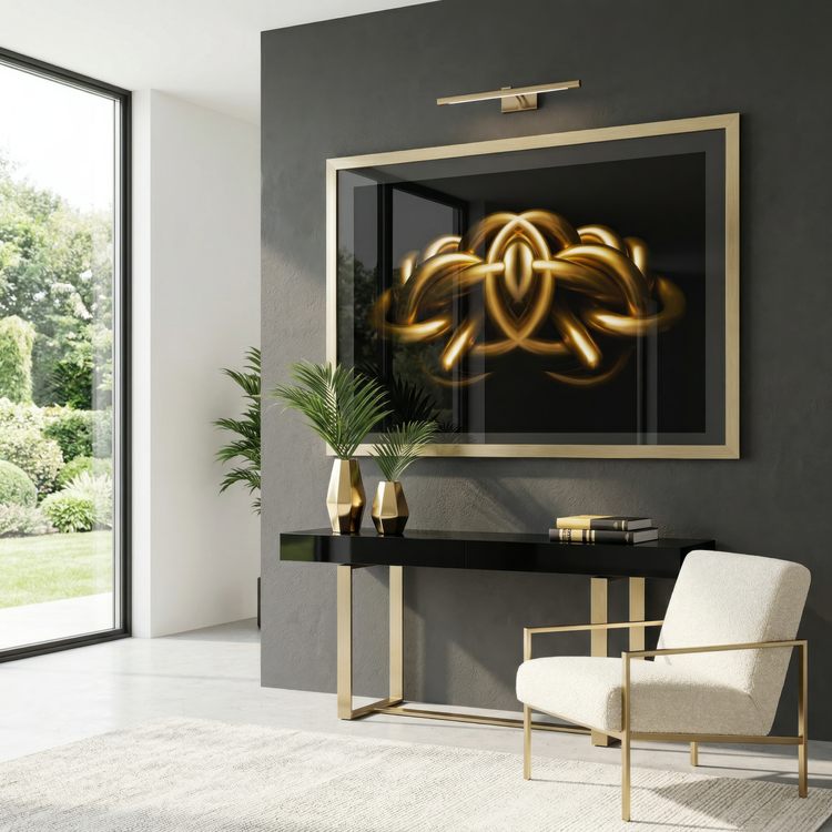 Modern interior with a black wall, gold-framed photographic artwork, and a white chair.