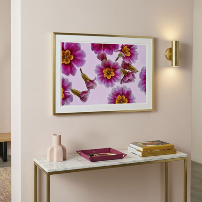 Floating Gardens 050 framed floral photograph on a wall above a marble console table with decorative items.