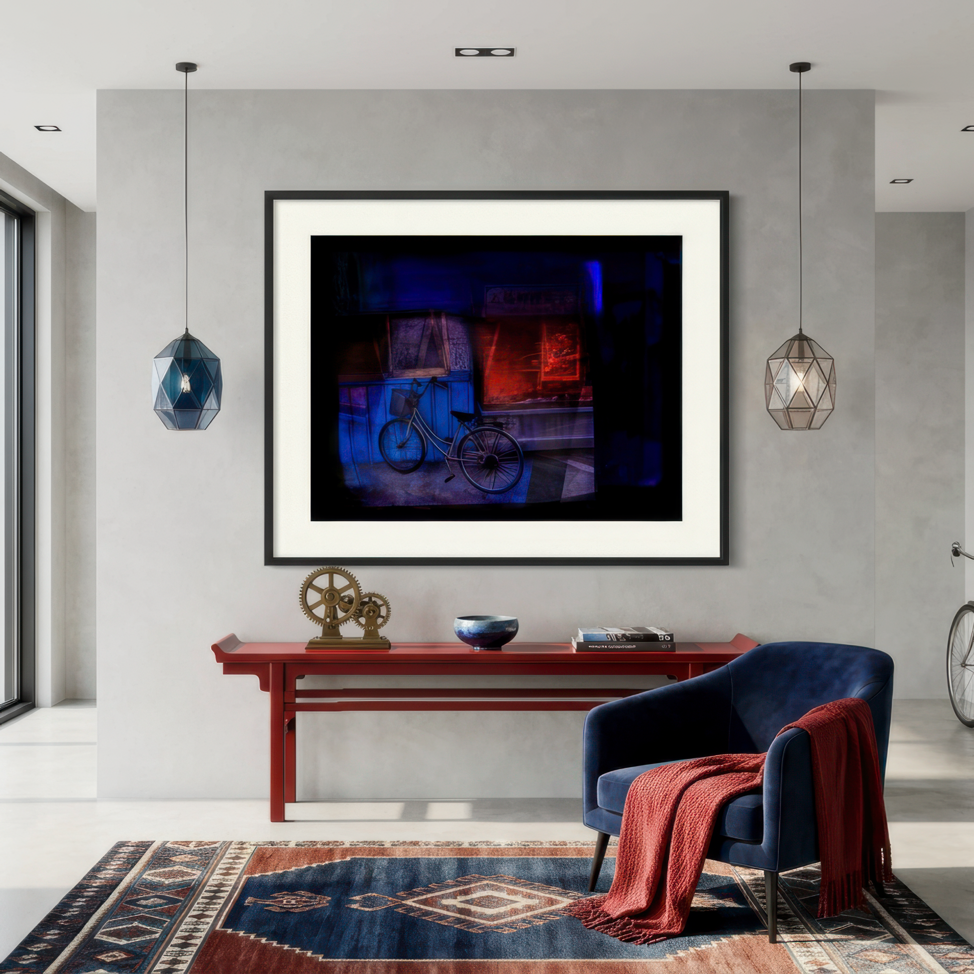Modern living room with a framed artwork on the wall, a blue chair, and a wooden console table.