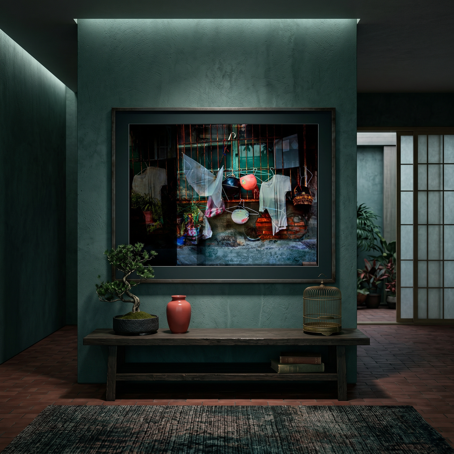 Framed artwork on a wall in a dimly lit room with a wooden bench and decorative items.