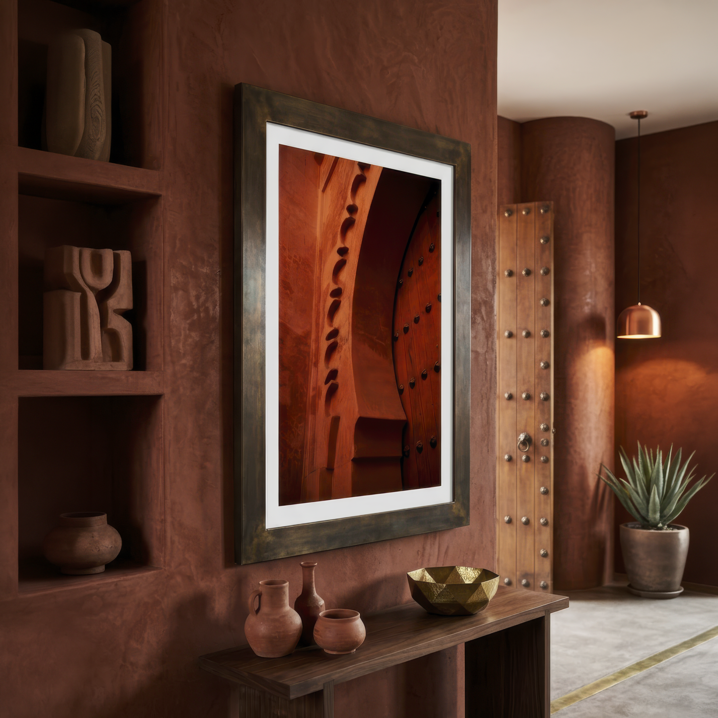 Framed photograph of Marrakesh archway on a wall in a warm-toned room with decorative elements.