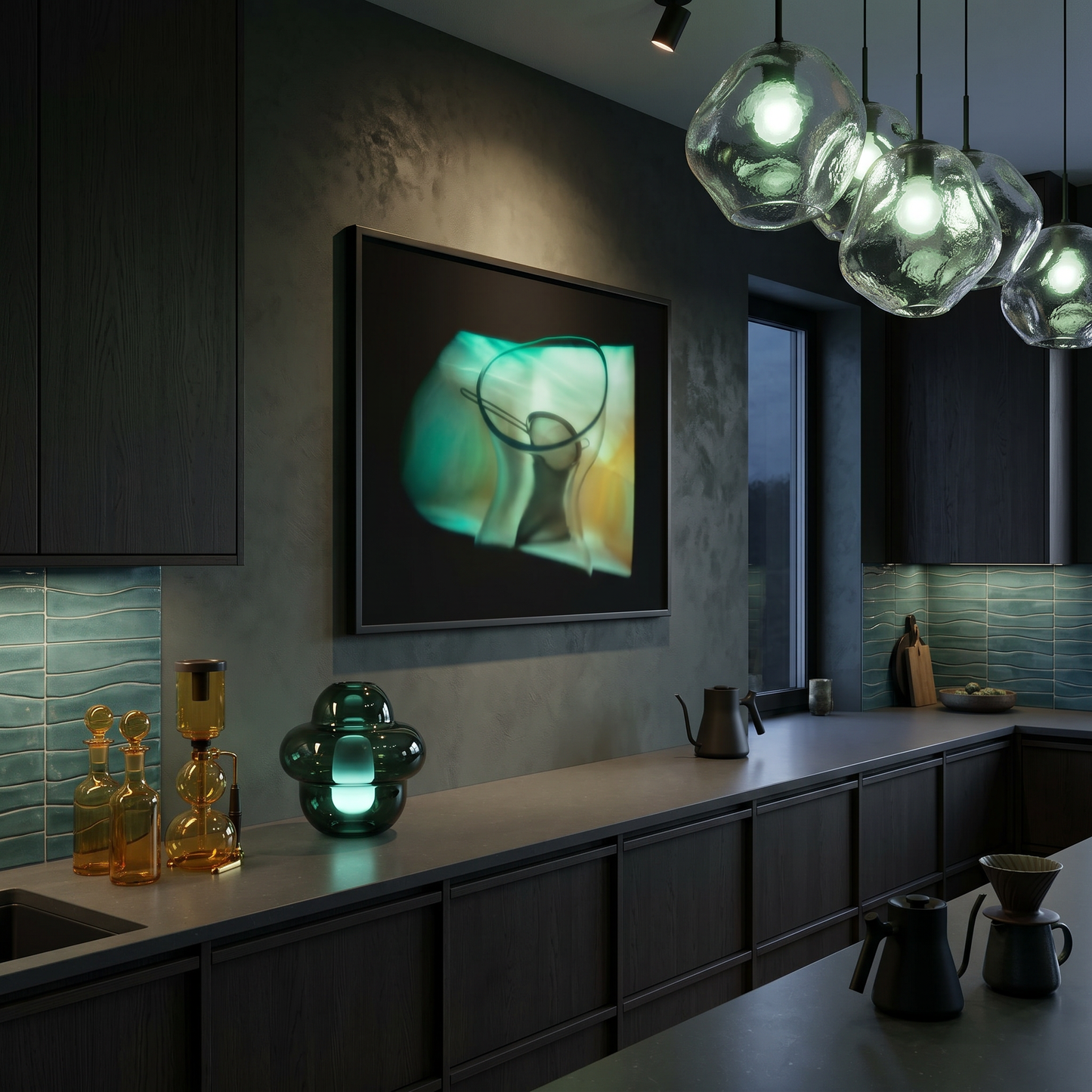 Modern kitchen interior with dark cabinets, a countertop, and decorative glass items.