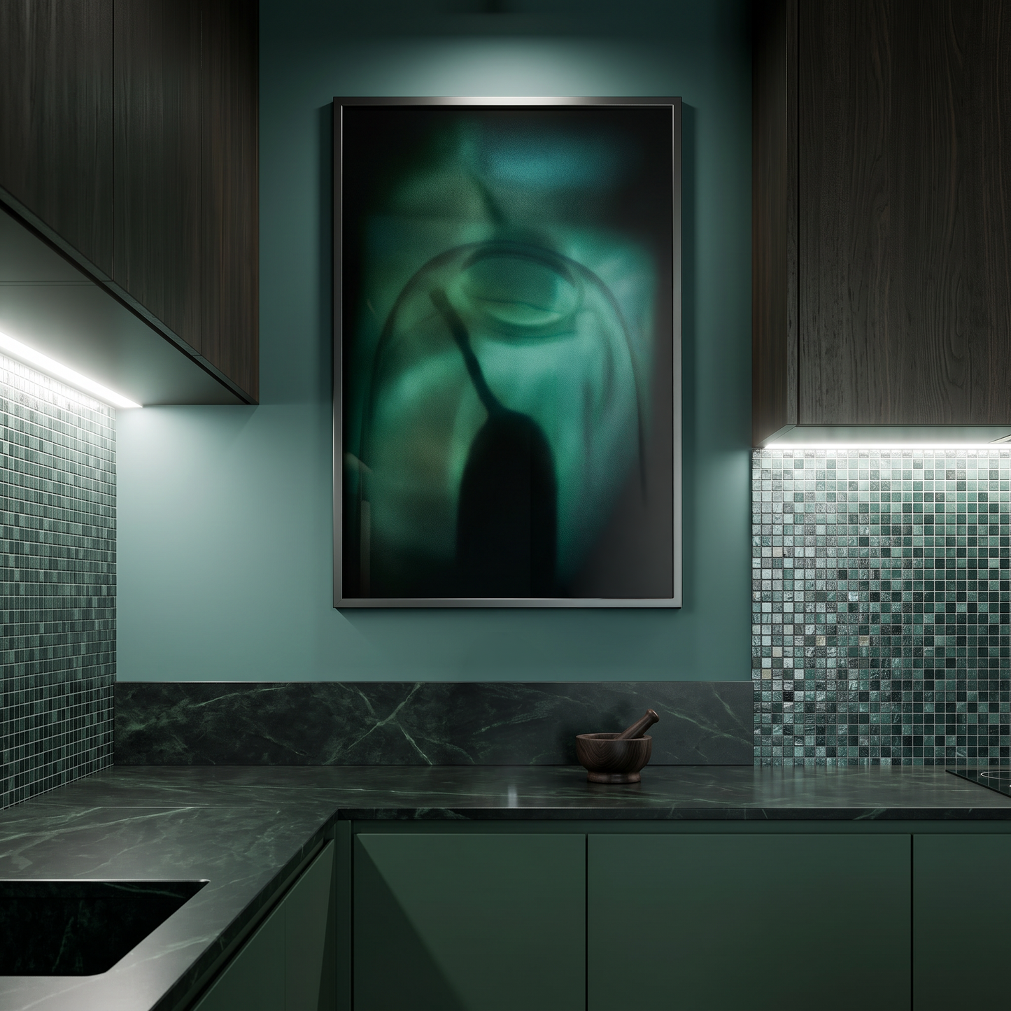 Modern kitchen with dark green cabinets, marble countertop, and abstract artwork on the wall.