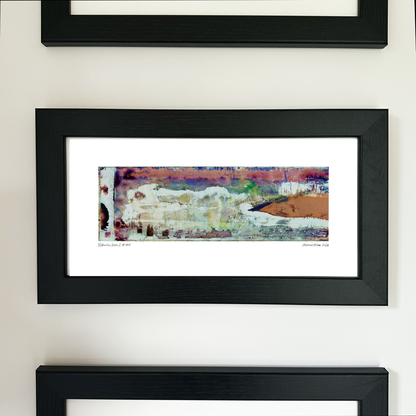 A framed abstract art print with a black frame and white mat, featuring Naturalia II #005 in peach, pink and green tones, mounted on a white wall.
