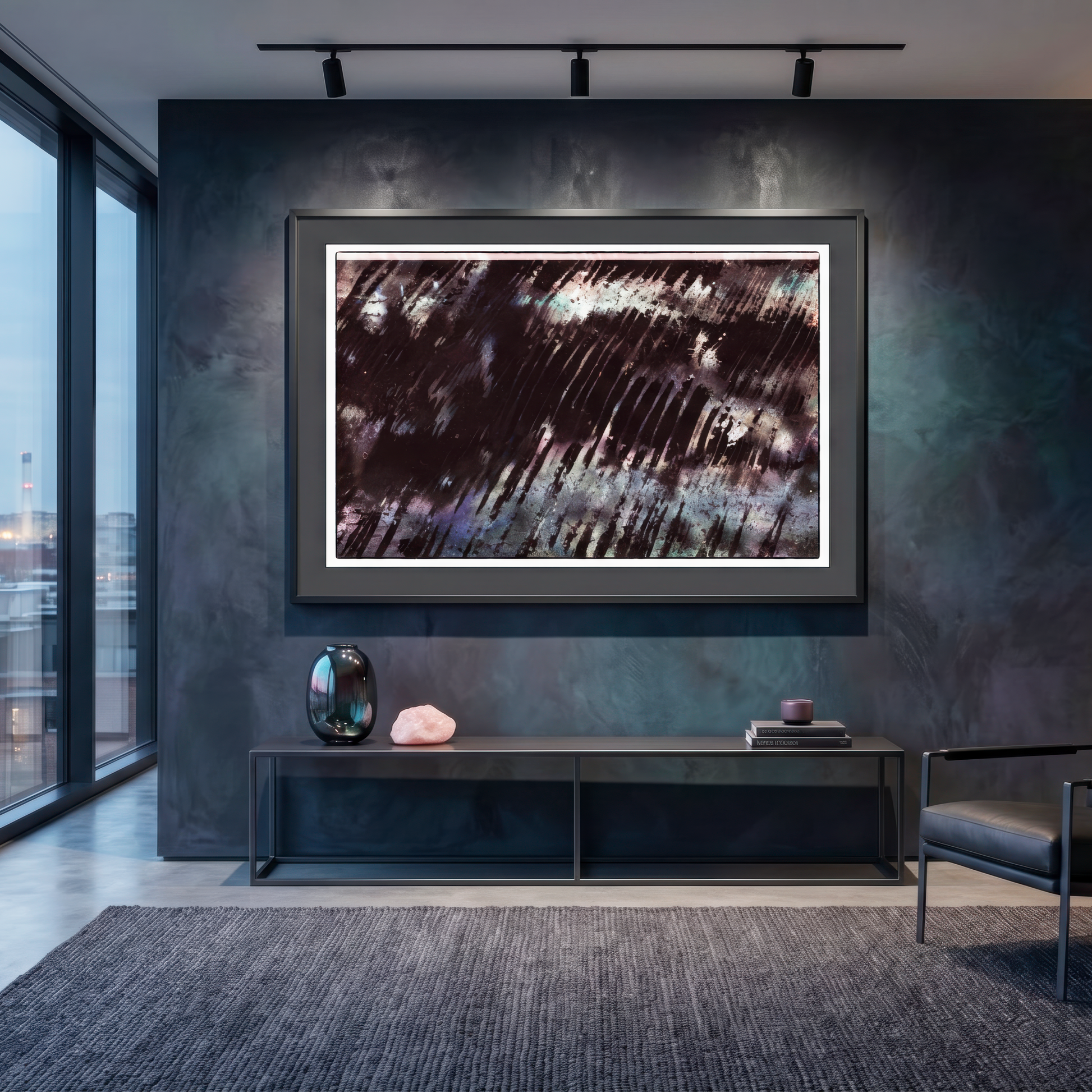 Modern living room with abstract artwork on a dark wall, large windows, and minimal decor.