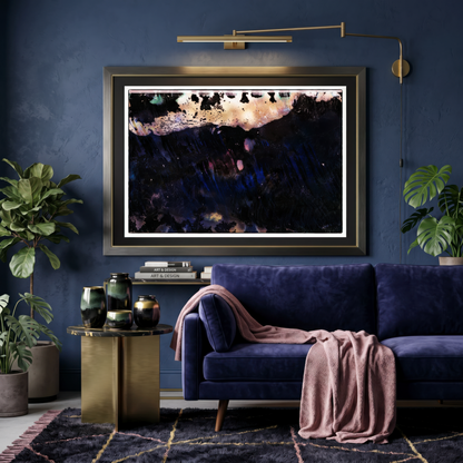 Modern living room with a blue sofa, decorative table, and framed artwork on a dark blue wall.