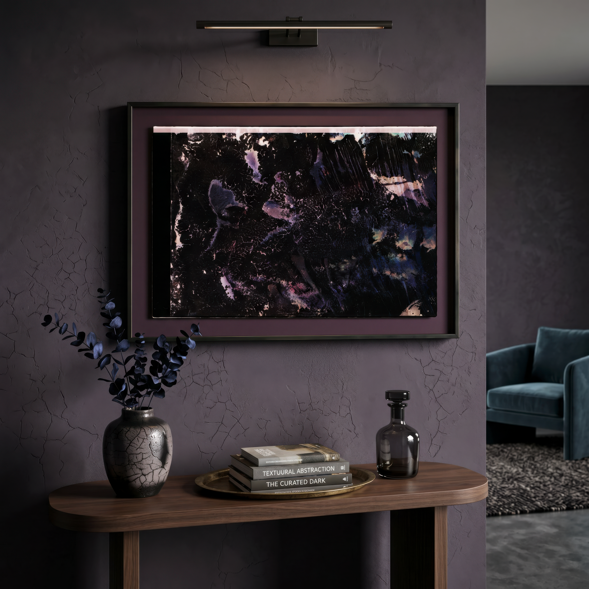 Framed abstract artwork on a dark wall with decorative items on a wooden console table.