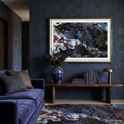 Modern living room with a dark wall, purple sofa, and abstract art.