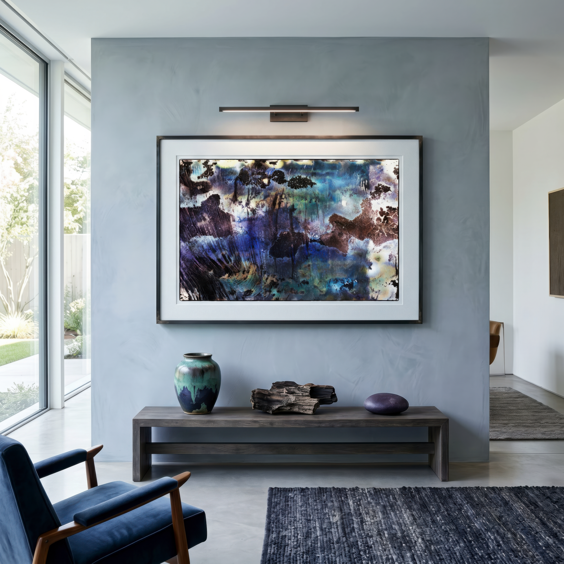 Modern living room with abstract artwork on a gray wall