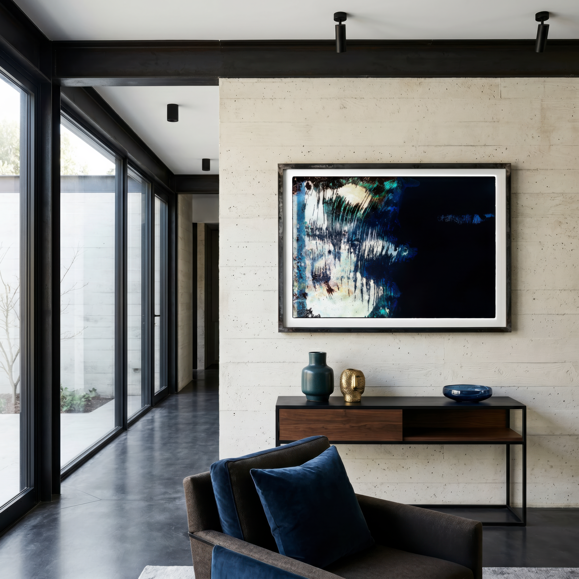 Modern living room with a sofa, coffee table, and wall art.