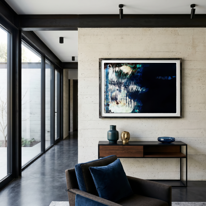 Modern living room with a sofa, coffee table, and wall art.