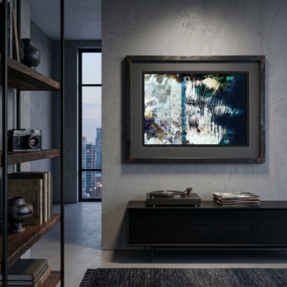 Modern interior with a framed abstract painting on a wall, a turntable, and books.