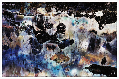 Abstract art piece with black, blue, and white colors