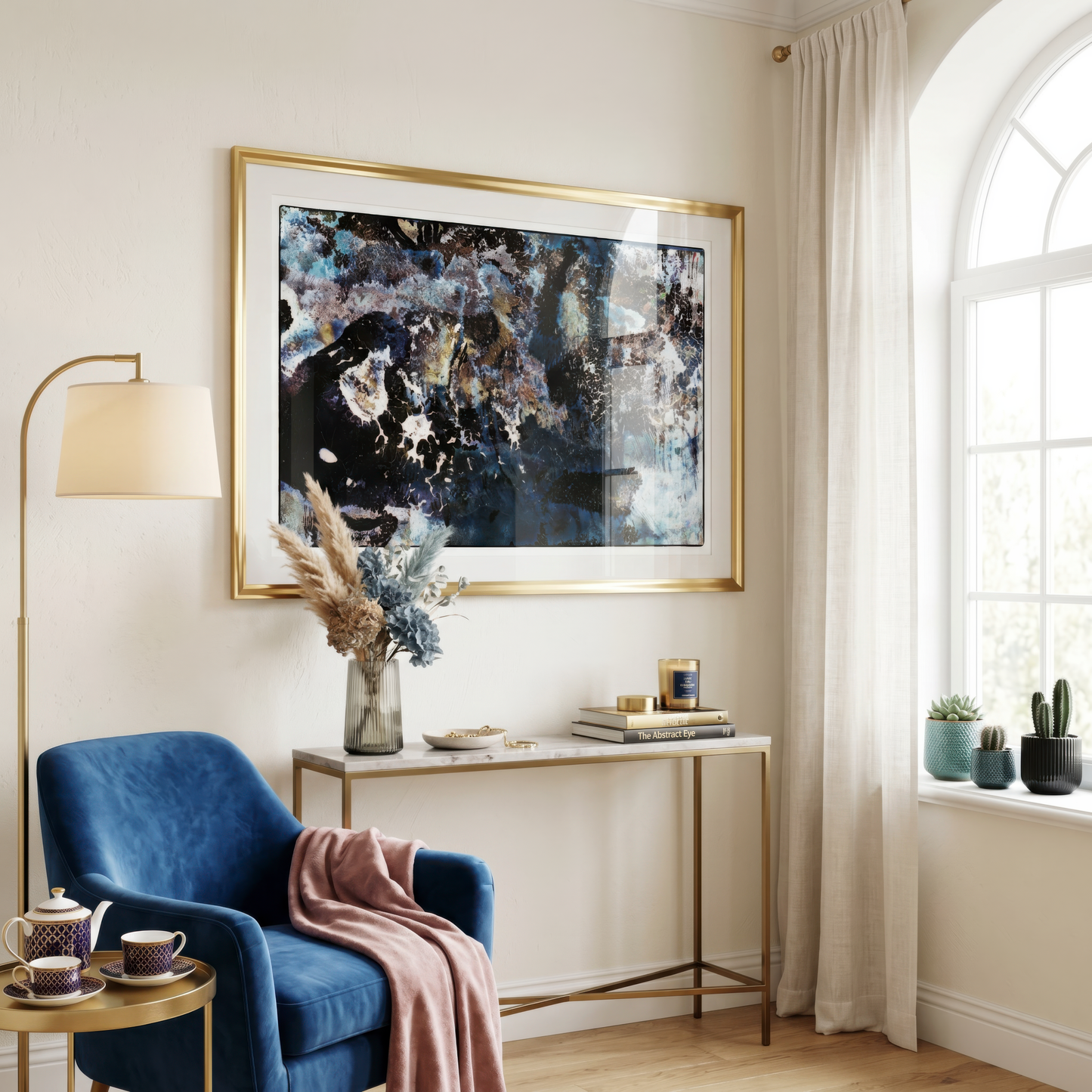 Modern living room with abstract art, blue armchair, and decorative items.