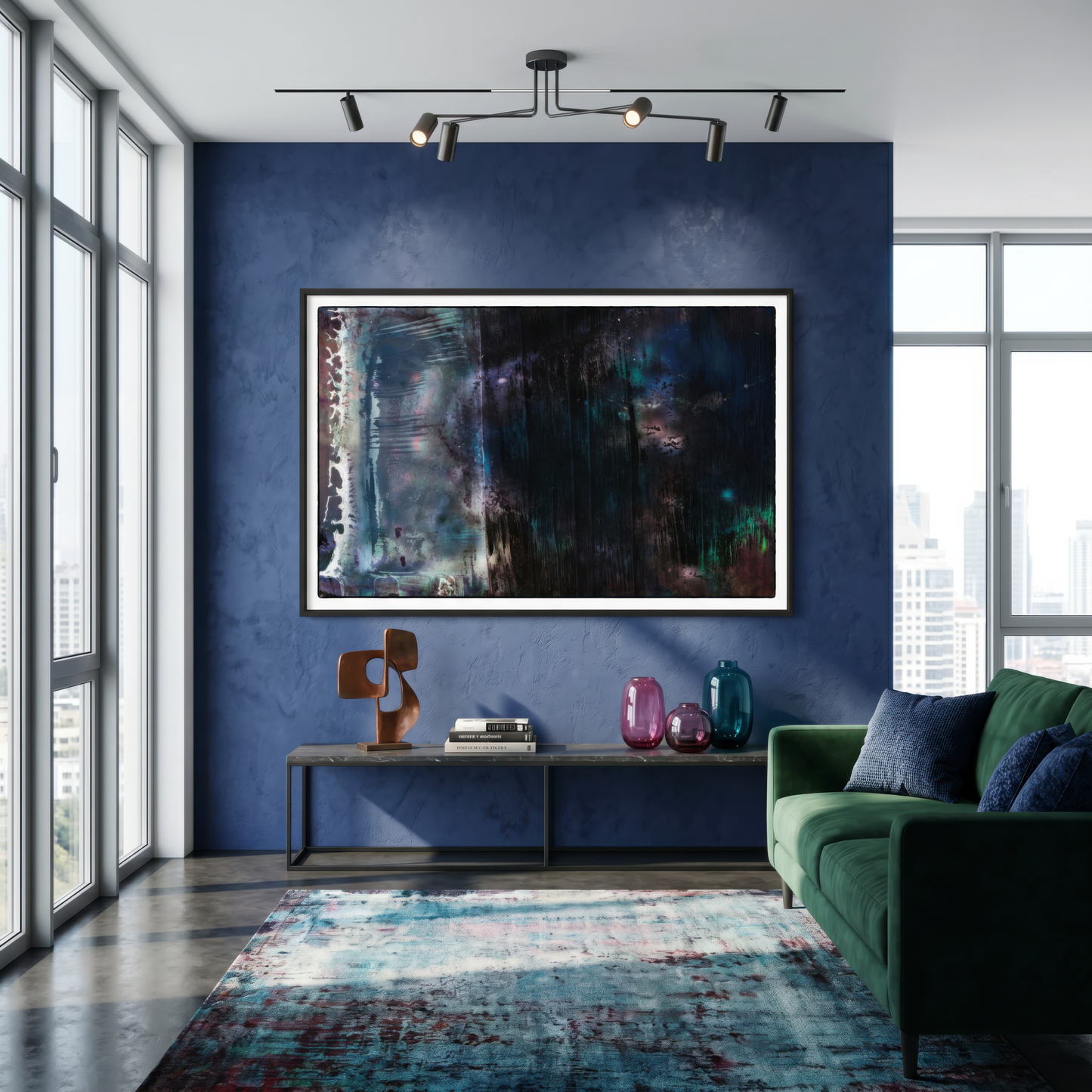 Modern living room with abstract art on a blue wall, green sofa, and decorative items.