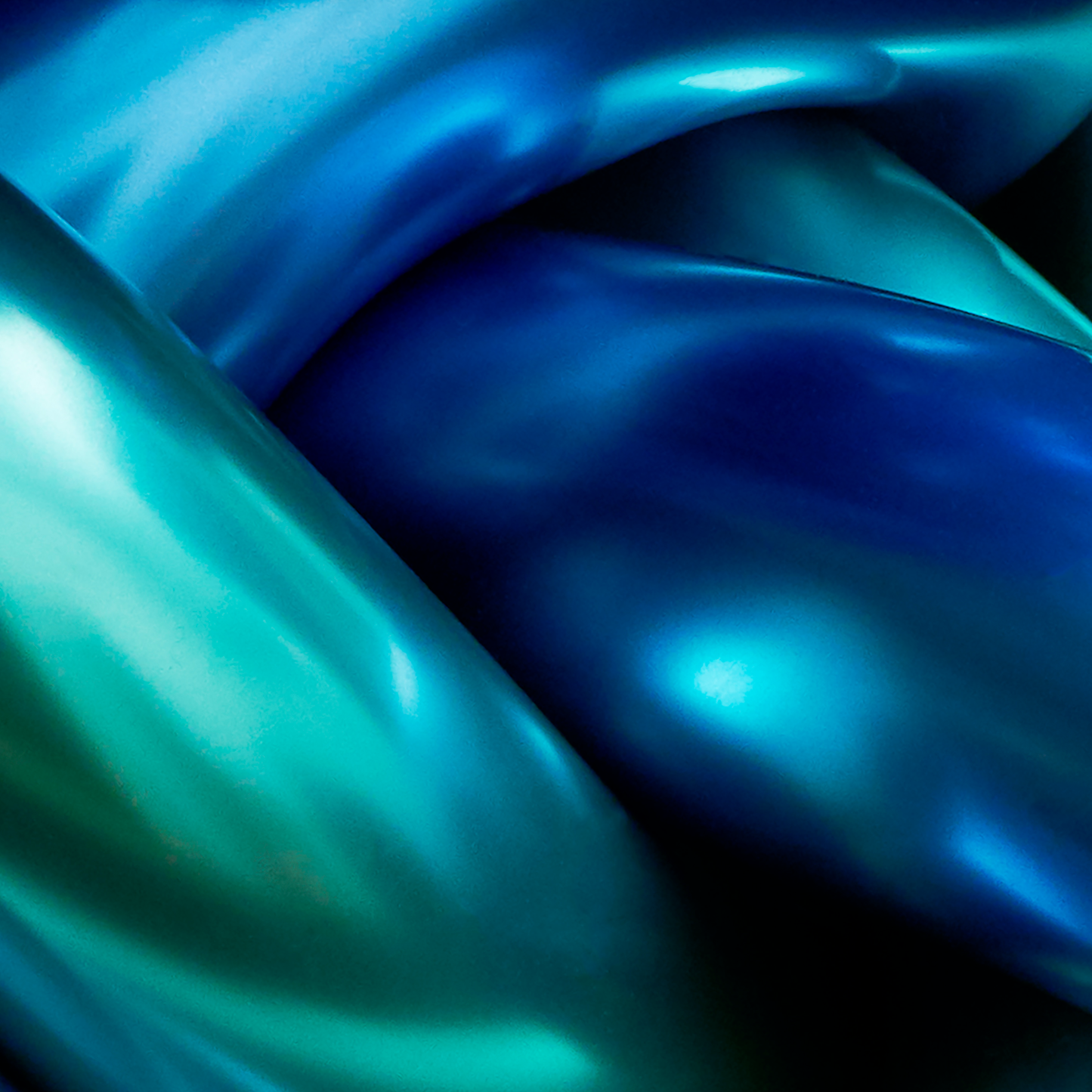 Close-up of blue and green chrome objects