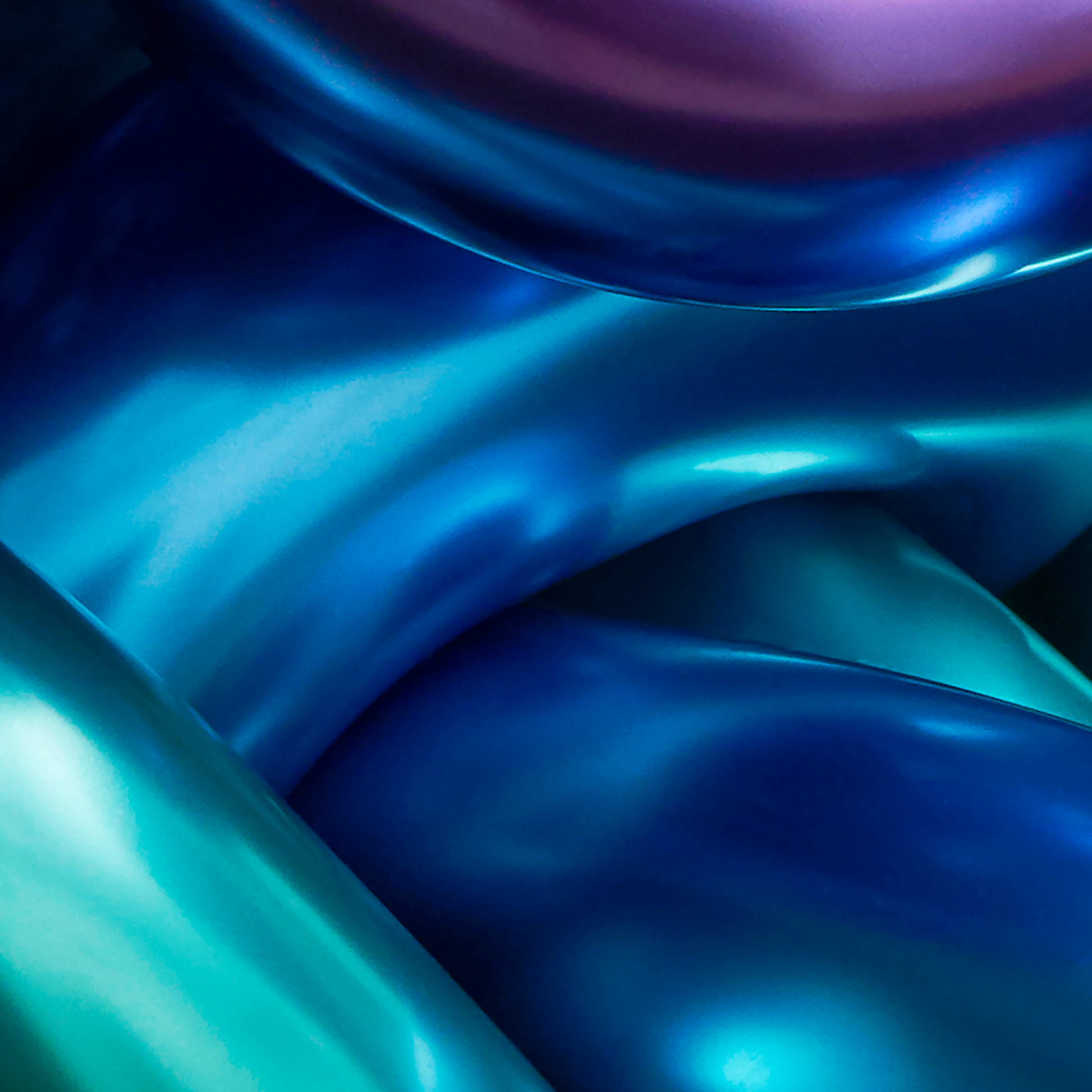 Abstract close-up of blue and green metallic surfaces