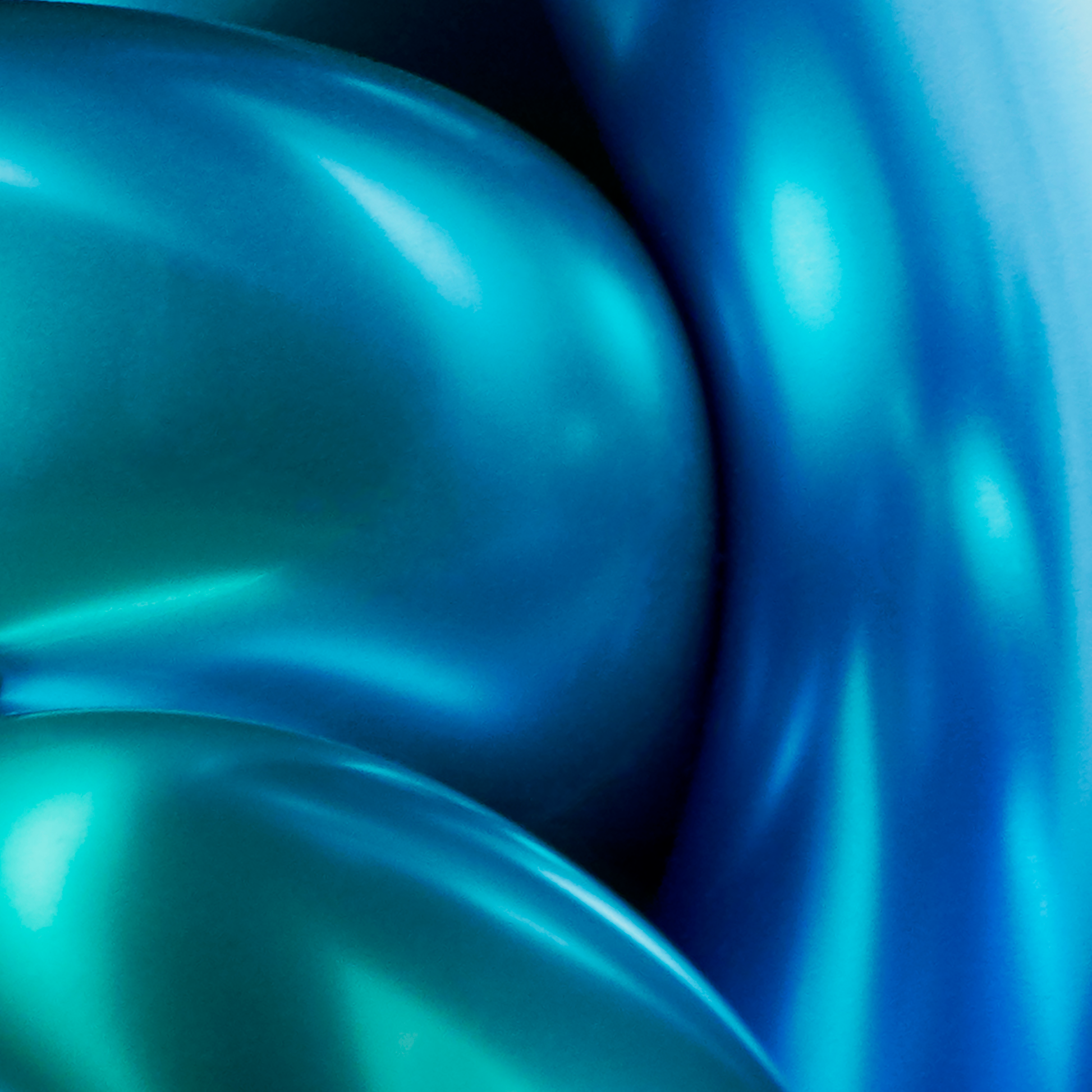 Close-up of blue metallic shapes with a gradient effect