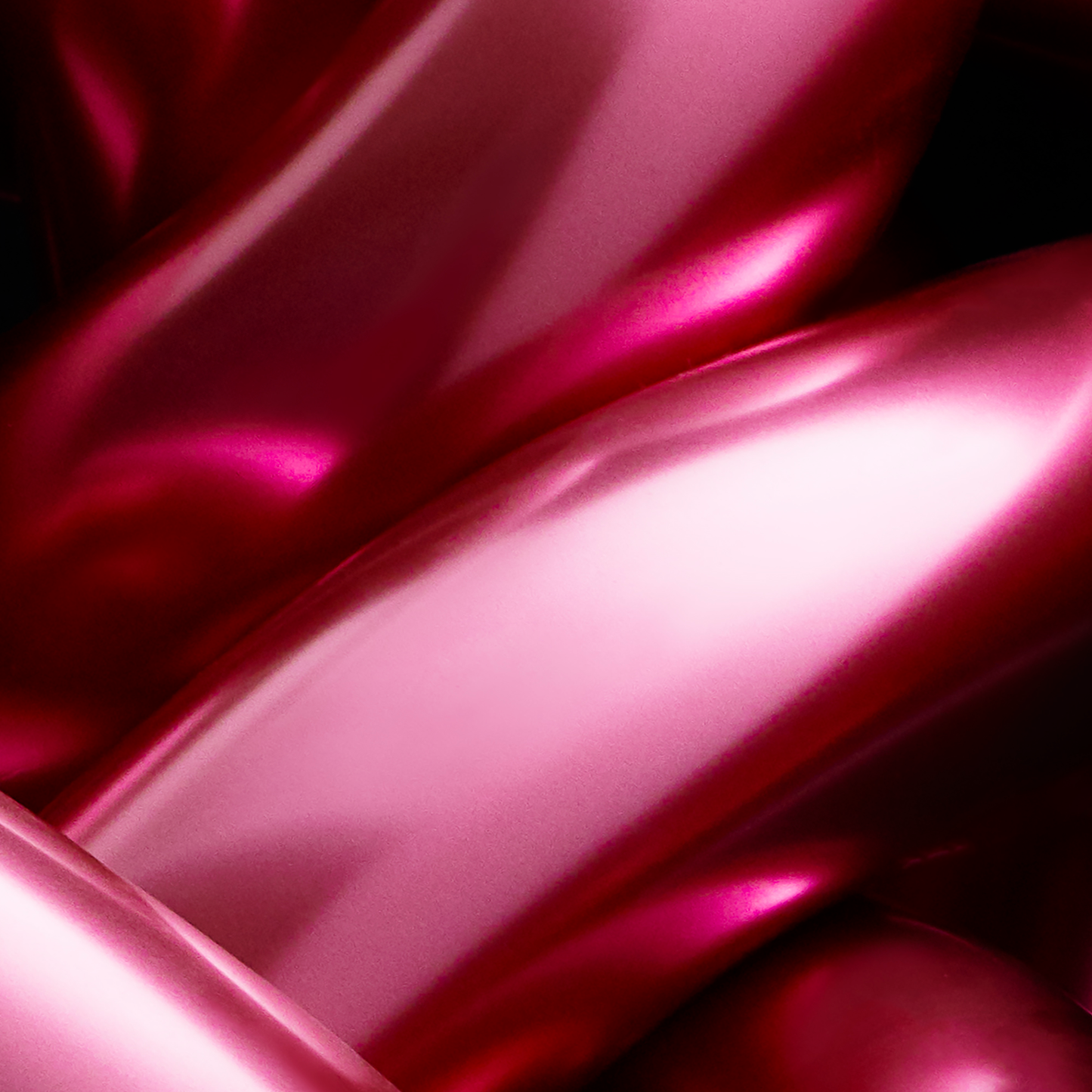 Close-up of pink metallic object with a glossy finish