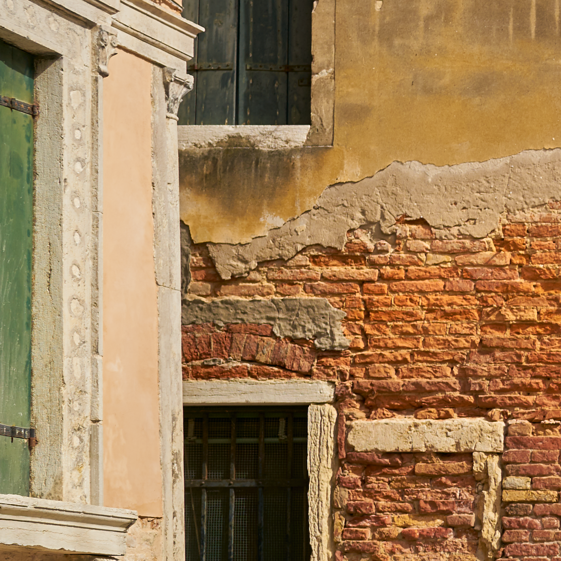 Close-up of an old building with textured walls and architectural details.
