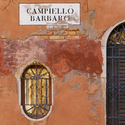 close up of photograph of wall and window in Venice showing weathered paintwork and street name