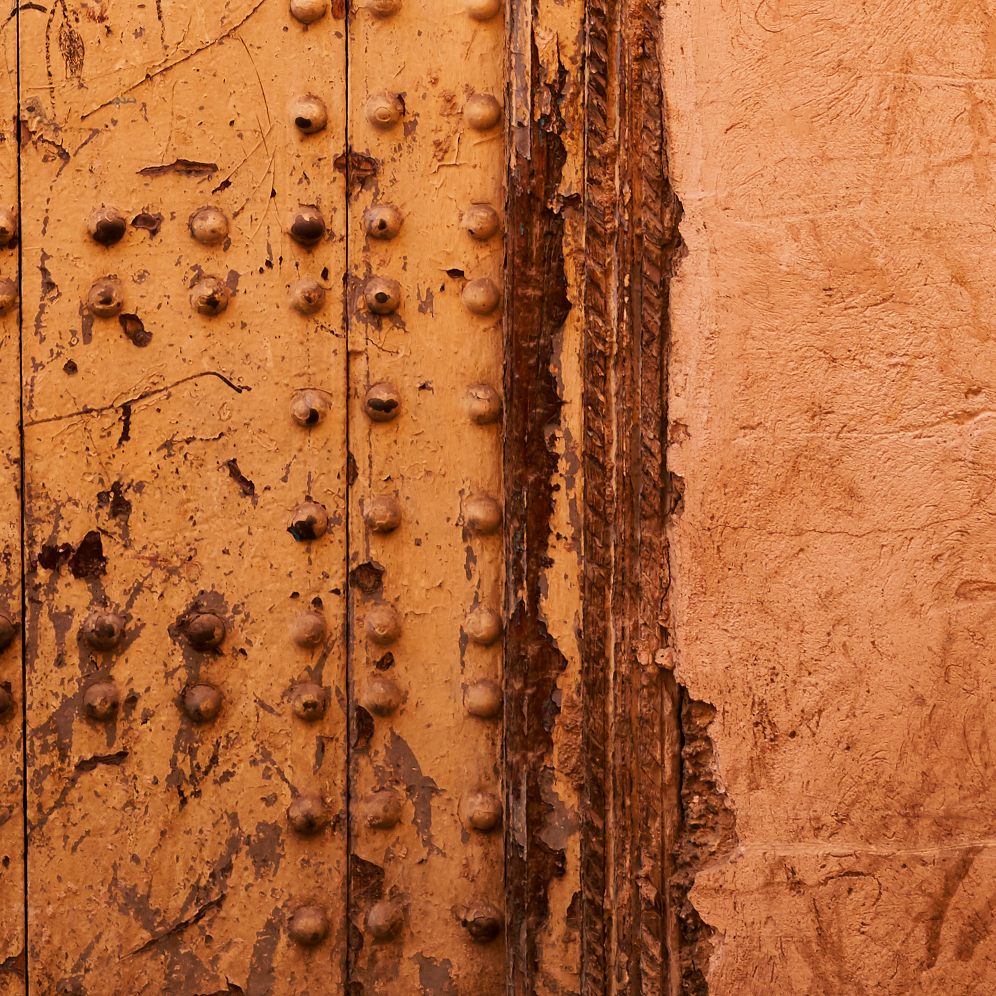 Close-up of a textured brown surface with rivets