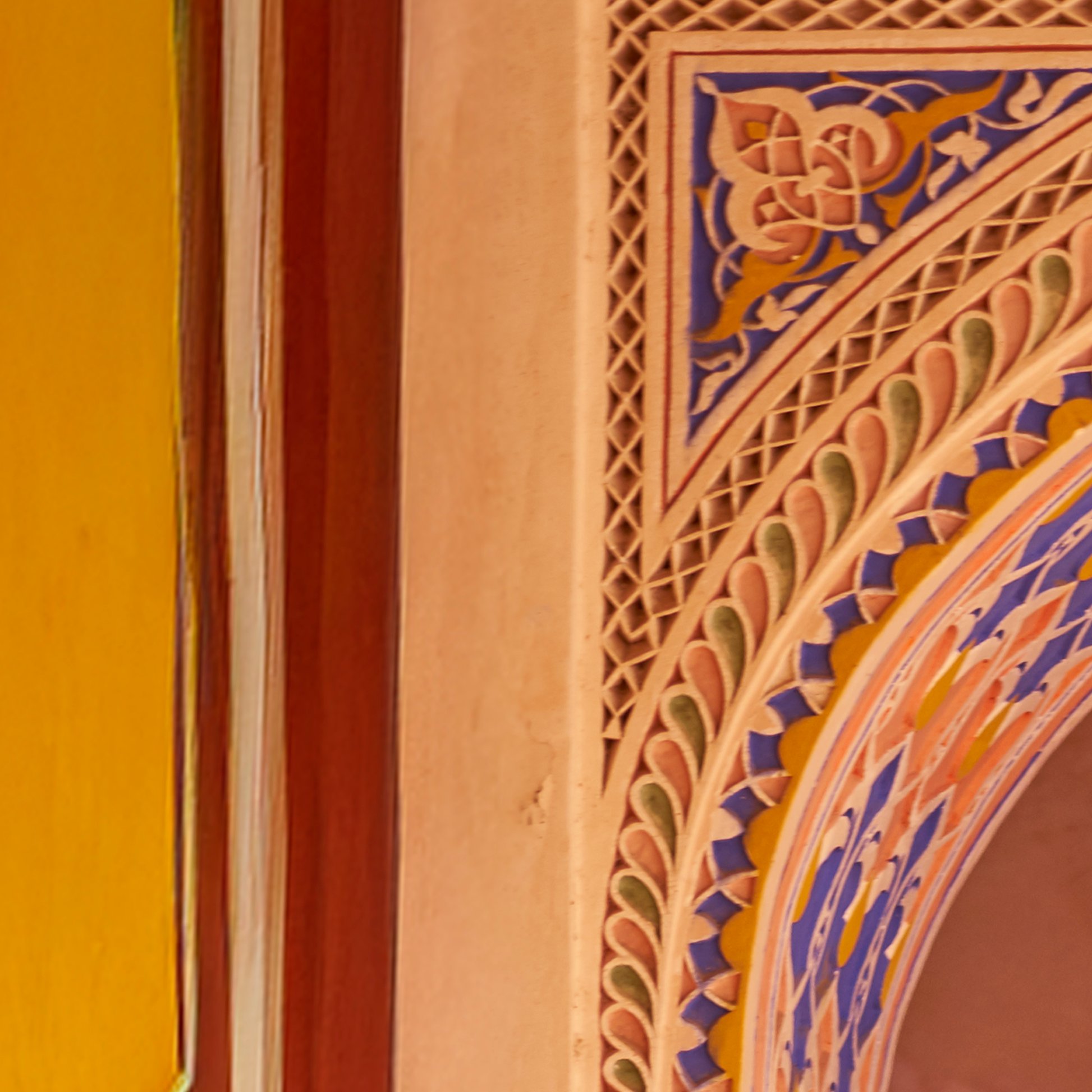 Decorative architectural detail with intricate patterns on a wall.