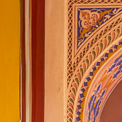 Decorative architectural detail with intricate patterns on a wall.