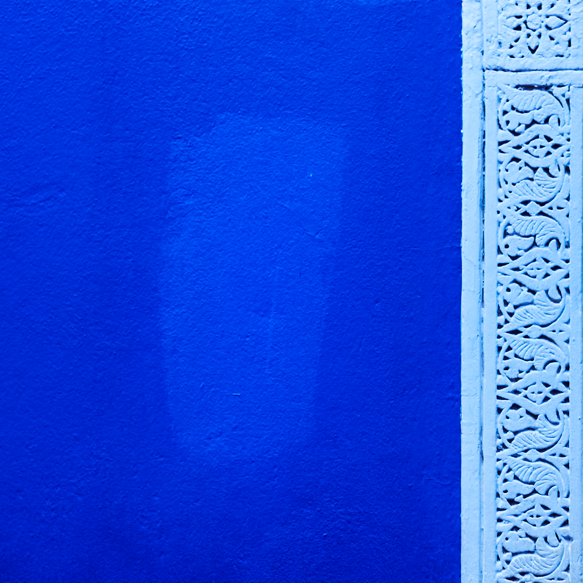Blue textured surface with a decorative white border