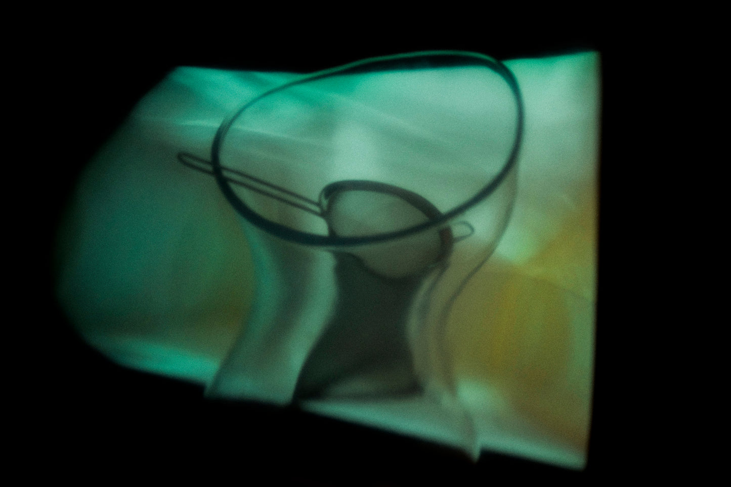 Warped reflection of objects creating abstract shapes, exploring how memories change over time