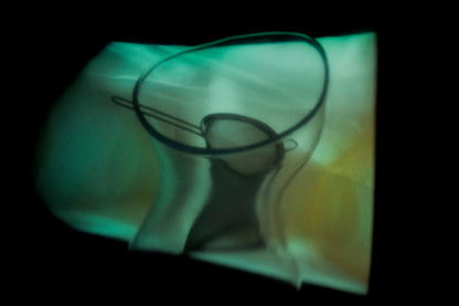 Warped reflection of objects creating abstract shapes, exploring how memories change over time