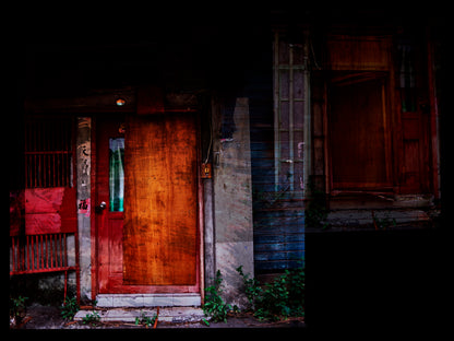 Multiple exposure of Wooden door with a red frame on a dark background in Taiwan