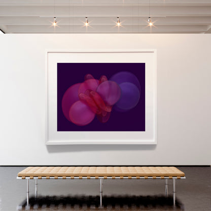 Framed abstract artwork on a white wall with a wooden bench below.
