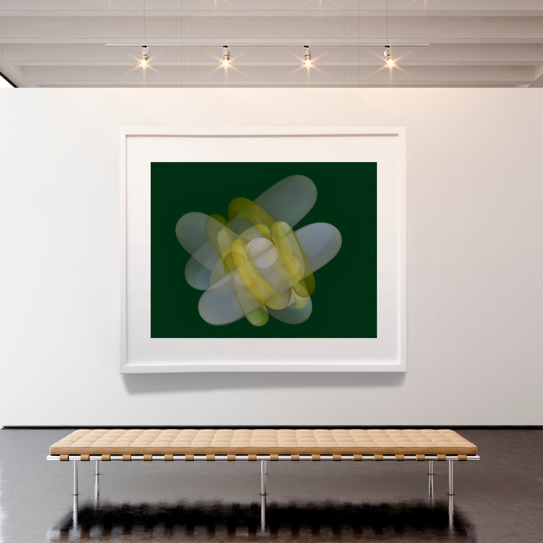 Framed abstract art piece on a wall above a wooden bench.