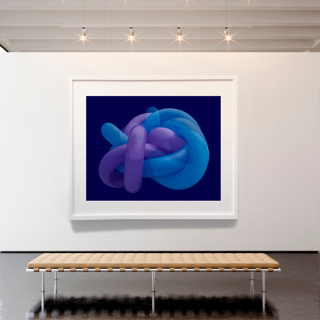 Framed abstract art of a blue and purple knot on a white wall with a wooden bench below.
