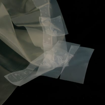 Abstract art piece with overlapping translucent shapes on a dark background