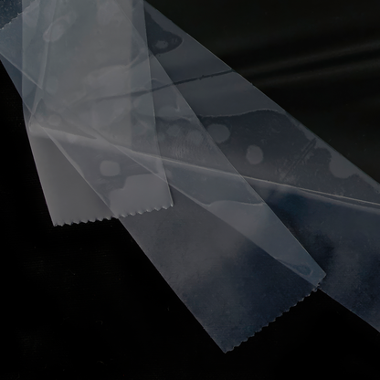 Close up of photograph of image of a reflection of a puddle wrapped in plastic