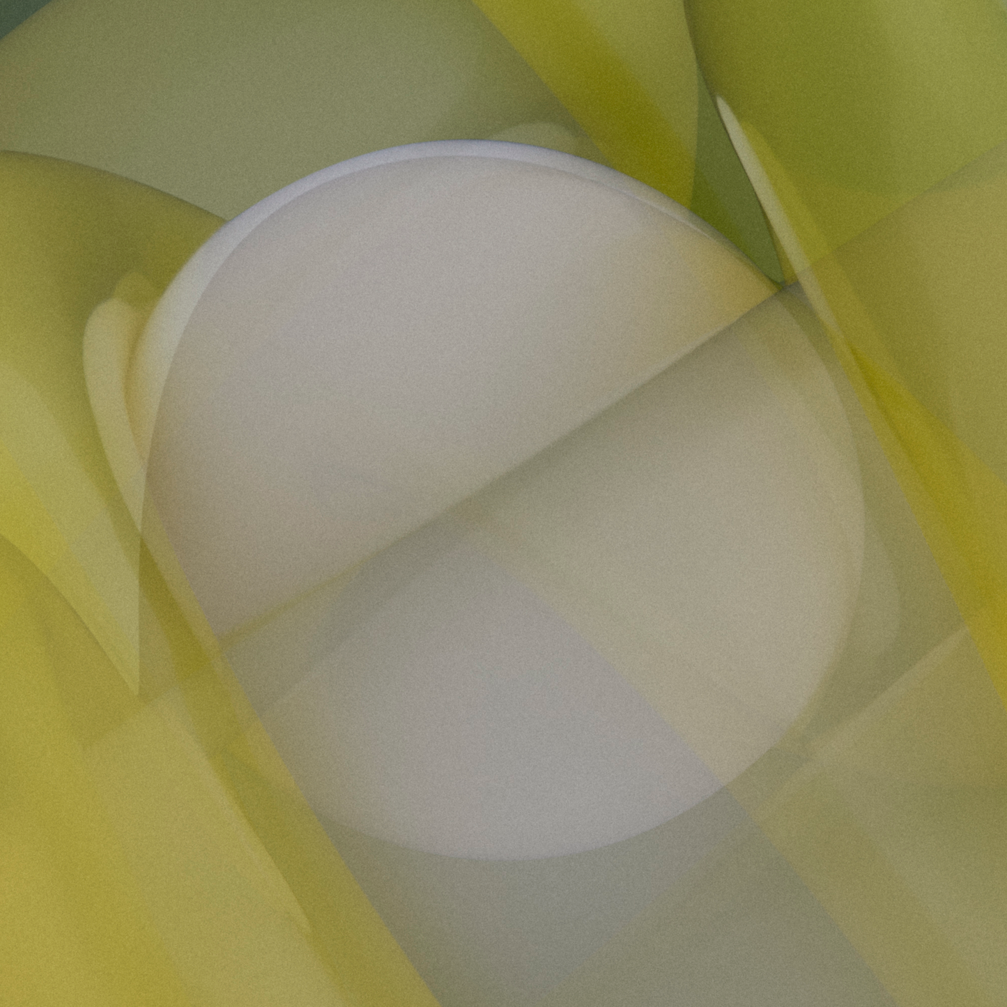 Close-up of a white sphere with yellow shapes in the background
