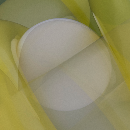 Close-up of a white sphere with yellow shapes in the background