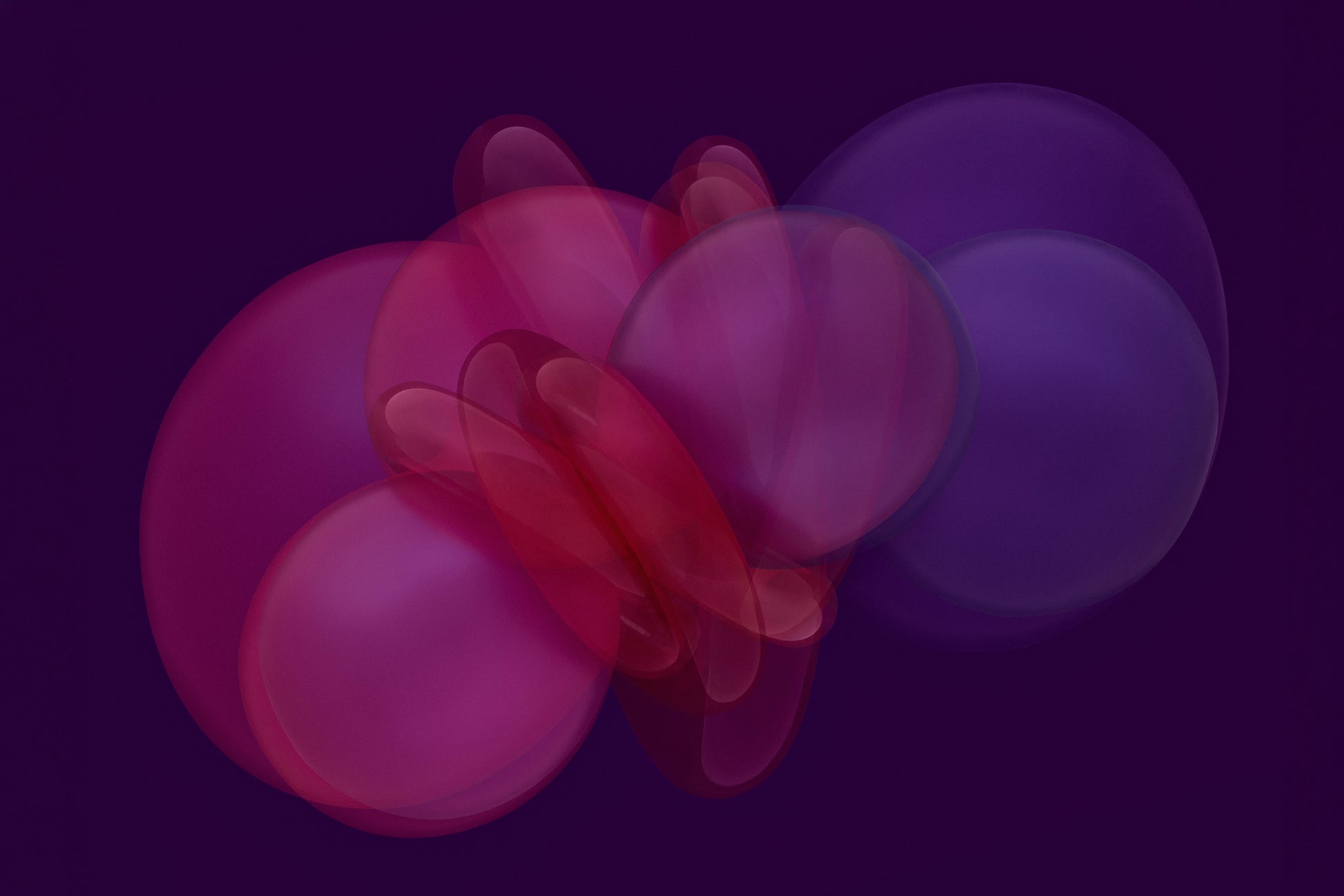 Abstract photograph of pink and purple geometric shapes on a dark background