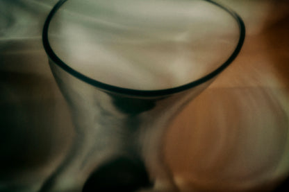 Warped reflection of objects creating abstract shapes, exploring how memories change over time