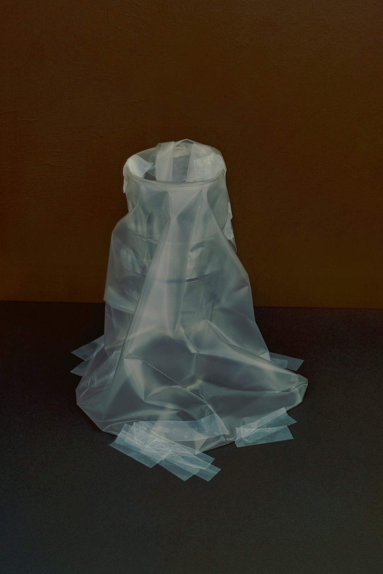 Four glasses wrapped in plastic storing them as a memory